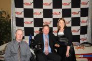 John and Liz Mize with Sam Schmidt